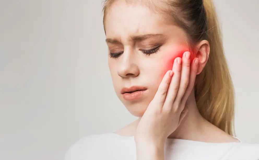 patient suffering from tmj pain