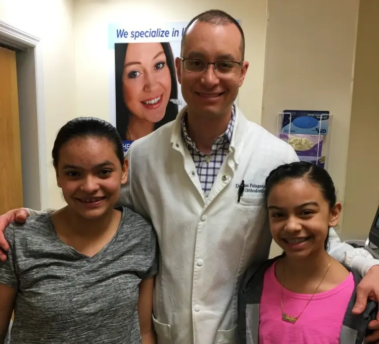 Two Braces Patients Smiling with Orthodontist