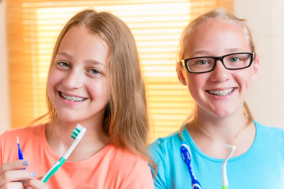 kids smiling brushing oral care