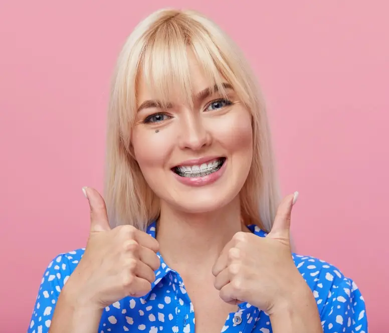 smiling woman happy about free braces